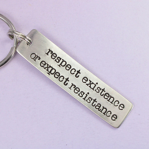 "Respect existence or expect resistance"  Hand Stamped Keychain