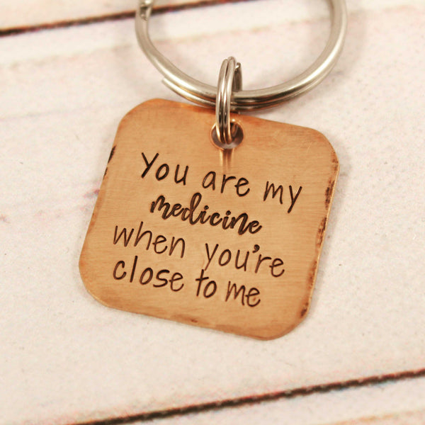 "You are my medicine when you're close to me" copper keychain - Completely Hammered