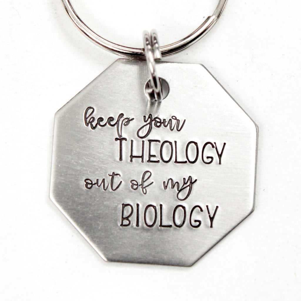 "Keep your theology out of my biology" Stainless Steel keychain.