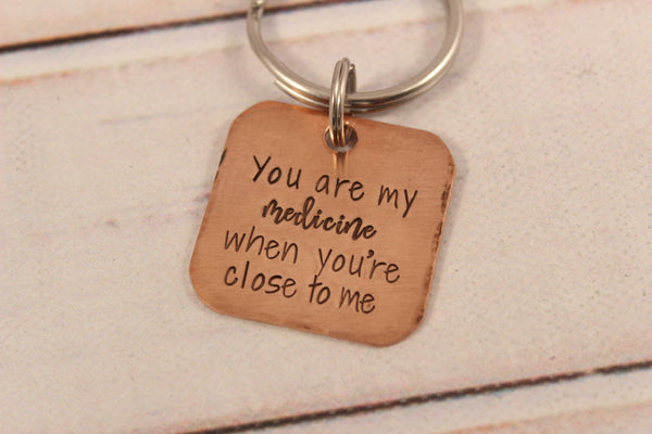 "You are my medicine when you're close to me" copper keychain - Completely Hammered