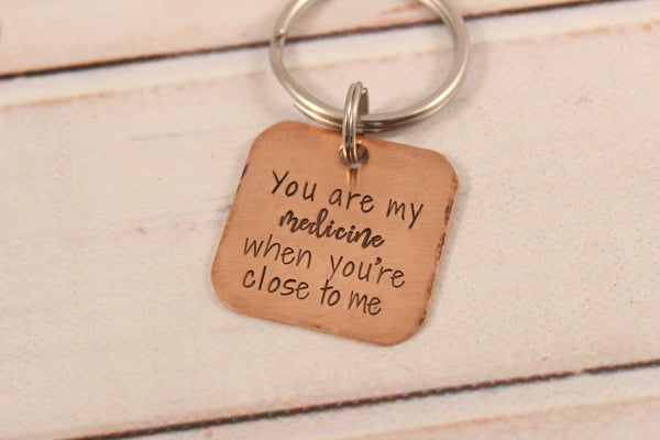 "You are my medicine when you're close to me" copper keychain - Completely Hammered